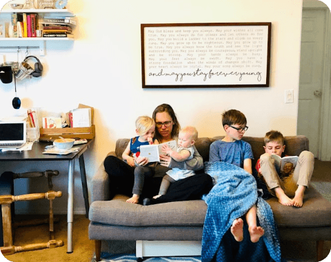 Young person engaged in a supportive conversation with a counsellor in a safe, child-friendly environment